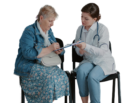 Two women sitting facing each other filling out a form on a clipboard